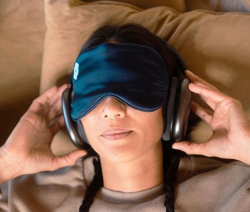 Young woman with eye mask and headphones during Wondermed at-home ketamine treatment session