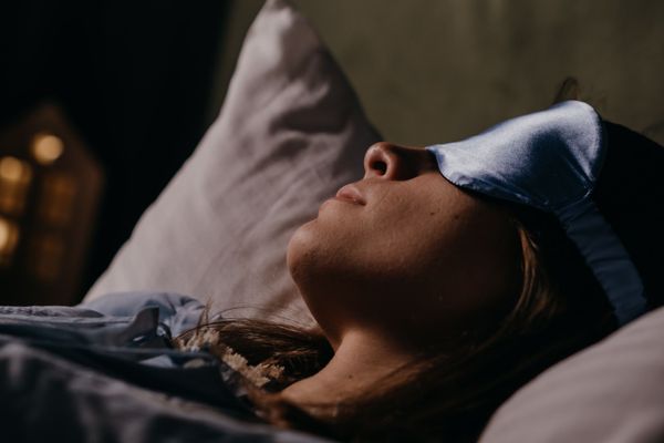 woman laying down eye mask ketamine treatment